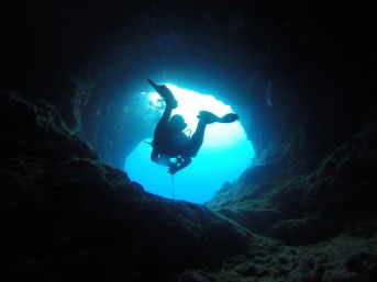 Underwater cave with diver